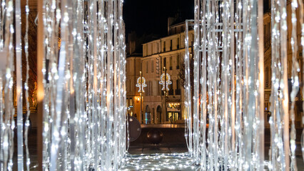Curtain of light garlands showing the city, by night, Christmas is approaching