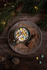 hot chocolate with marshmallows. cocoa with marshmallows in New Year decorations. a hot drink with a winter mood