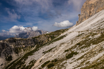 Clouds over mountain trail Tre Cime di Lavaredo in Dolomites in Italy