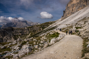 Fototapeta na wymiar Clouds over mountain trail Tre Cime di Lavaredo in Dolomites in Italy