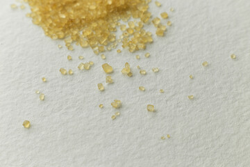 cane sugar scattered on a light gray surface