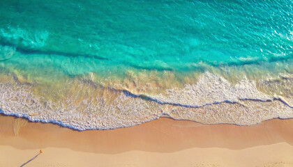 Aerial drone shot of turquoise sea water at beach
