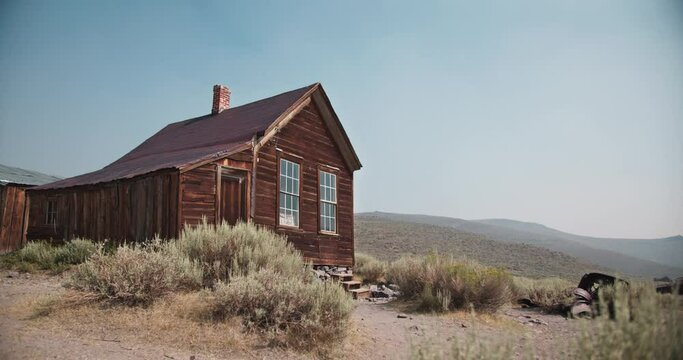 Rustic historic wooden home in the hills of the gold rush mining area in western America