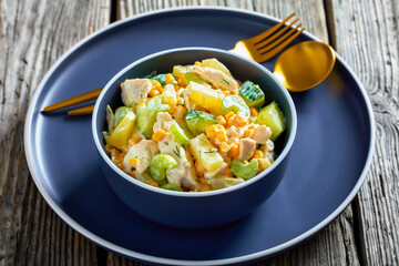 salad of chicken breast, corn, ananas, cucumber