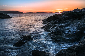 VANCOUVER ISLAND, BC - A sunset over the ocean in Tofino.