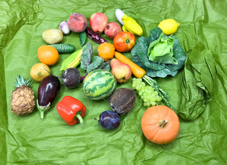 A mix of mini vegetables and fruits on an isolated background