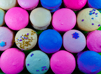 Fototapeta na wymiar Colorful french macarons background in close up