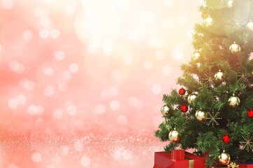 Festively Decorated Outdoor Christmas tree on sparkling fairy background.