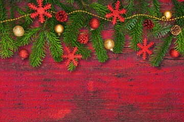 Christmas banner with fir branches and decorations on desk background.