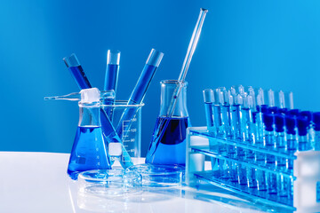 The chemicals are in many glass tubes.Stand to show glass cosmetic product. Research and develop beauty skincare product concept by scientific method with concept laboratory tests.