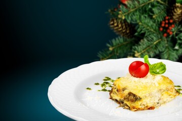 Piece of tasty hot lasagna on the desk. Traditional Italian food. Homemade pasta.