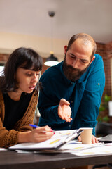 Businessman explaining company strategy to entrepreneur working at marketing project brainstorming...