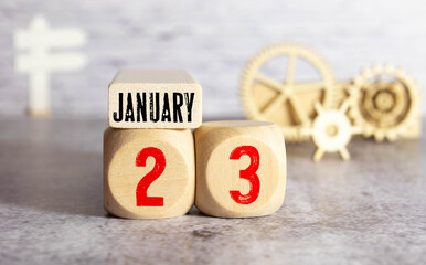 January 23, Date design with calendar cube and leaf on orange background for inserting your text
