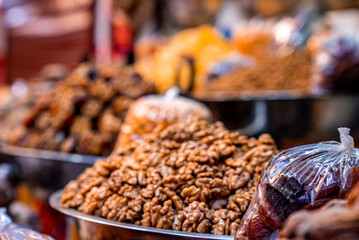 Close up of dry fruits like apricots, figs and walnuts for sale in the local market