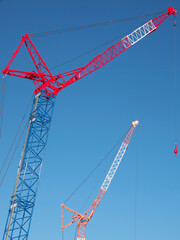 
Tokyo,Japan - December 15, 2021: Crawler Crane or Luffing Jib Crawler Crane on blue sky background
