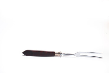 Closeup meat fork wooden handle white background