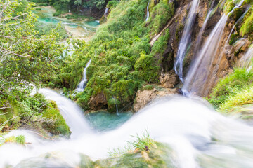 A waterfall flowing in Plitvice Lakes, view from above