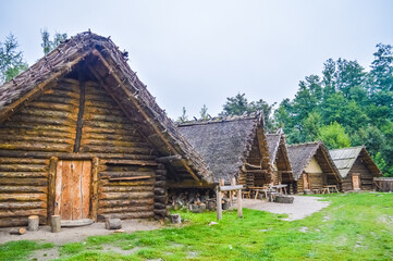 Plakat Very old wooden huts of the village of Biskupin, Poland