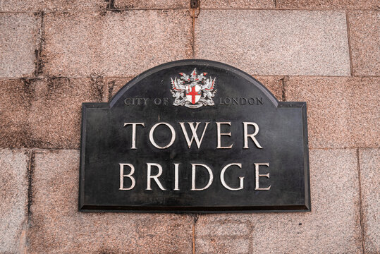 Tower Bridge London Plaque located on the Tower bridge in London. Beautiful lights over the sign.
