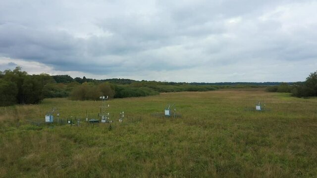 Station science research for studying wetlands meadows, drone aerial video shot ecosystem weather station swamp willows cycle carbon flux eddy covariance methane research physiological photosynthesis