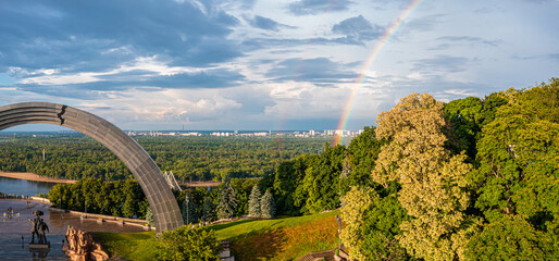 Panoramic view of Kyiv city with a beautiful rainbow over the city. Aerial view of the Arch of...