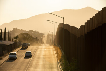 Tecate, Baja California, Mexico - September 14, 2021: Late afternoon sun shines on the USA Mexico...