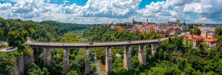 Aerial view of th ebeautiful bridge going over the green valley in Europe. © Aerial Film Studio