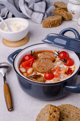 Beans soup with vegetables and sausages