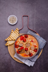 Beans soup with vegetables and sausages