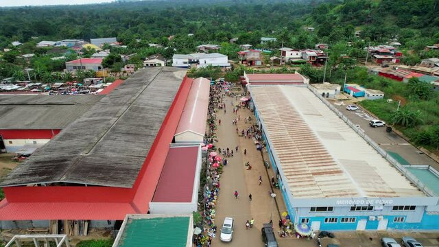 Aerial drone view over people shopping at the Bobo Forro market, in Sao Tome