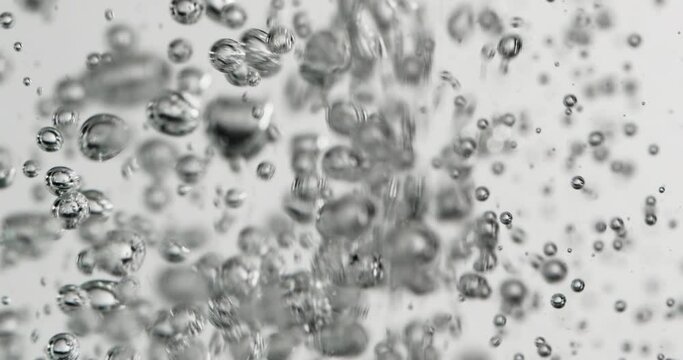  Bubbles Rising In Water Against White Background
