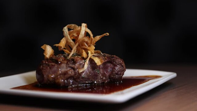 Serving Of Mouth-watering Beef Rossini In Plate With Sauce. zoom-in