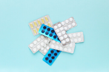 different pills on a blue background