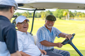 Group of Asian people businessman and senior CEO enjoy outdoor activity lifestyle sport golfing together at country club on summer vacation. Healthy male golfer sitting golf cart with talking together