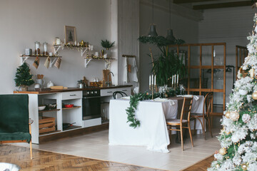 New Year's table setting. Waiting for Christmas. Kitchen interior with decoration. 