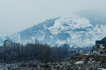 Clouds on the top of the mountain covered by snow after snowfall in Manali, Himachal Pradesh, India