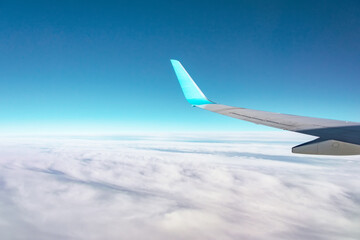 Wings of large passenger aircraft, flying at high altitude.