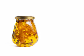 acacia honey in a glass jar on a white background