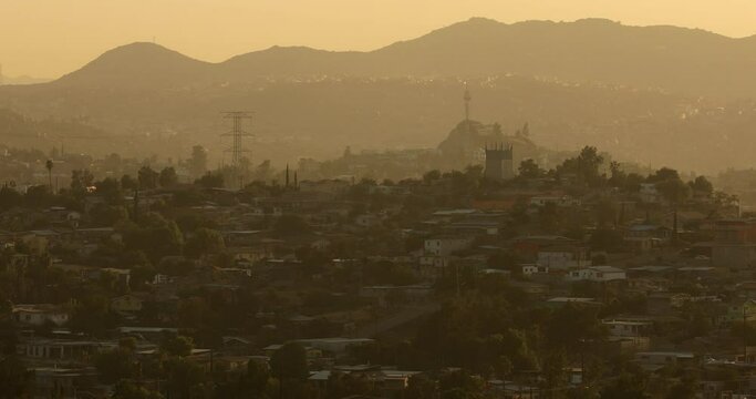 Tecate, Baja California, Mexico - September 14, 2021: Late afternoon sun shines on a bustling downtown Tecate.