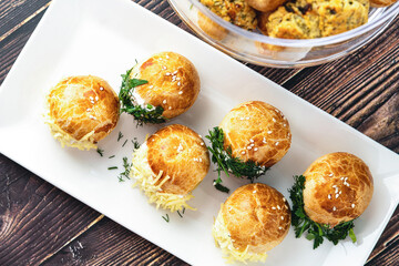 Turkish pastry filled with dill, parsley, cream cheese and cheddar cheese. Turkish name: Sakallı Pogaca or Saçaklı Pogaca
