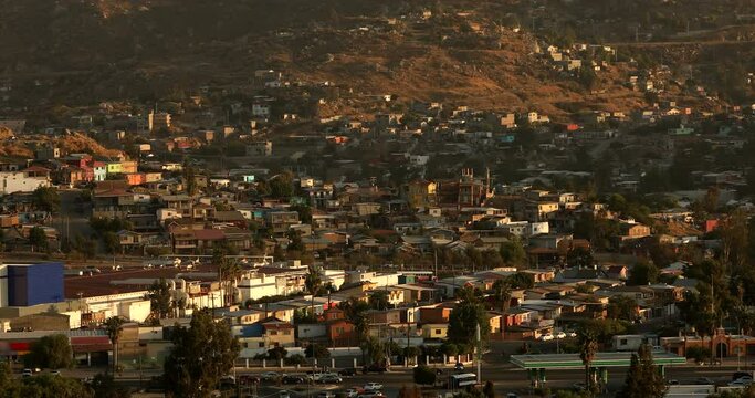 Tecate, Baja California, Mexico - September 14, 2021: Late afternoon sun shines on a bustling downtown Tecate.