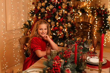 Happy New Year! beautiful girl near the Christmas table