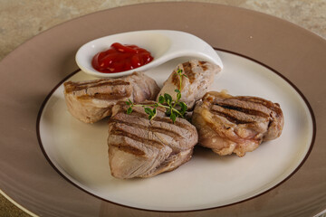 Grilled pork tenderlion with tomato sauce