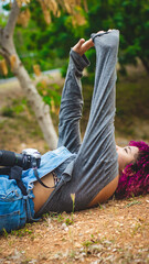 Fototapeta premium Girl who is dedicated to photography prepares from home to go to take photos of nature.