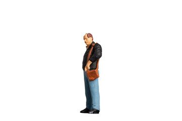 Miniature people Old man holding a shoulder bag  on white background with clipping path