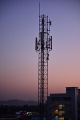 Silhouette Cellular communications Tower or 4G 5G of Network telephone with dusk sky in beautiful sunset