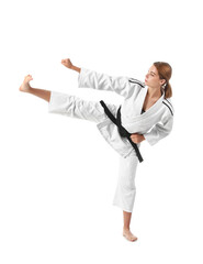 Young woman practicing karate on white background