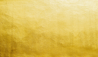 Gold wall texture background. Yellow shiny gold metal sheet surface with light reflection, vibrant golden luxury wallpaper