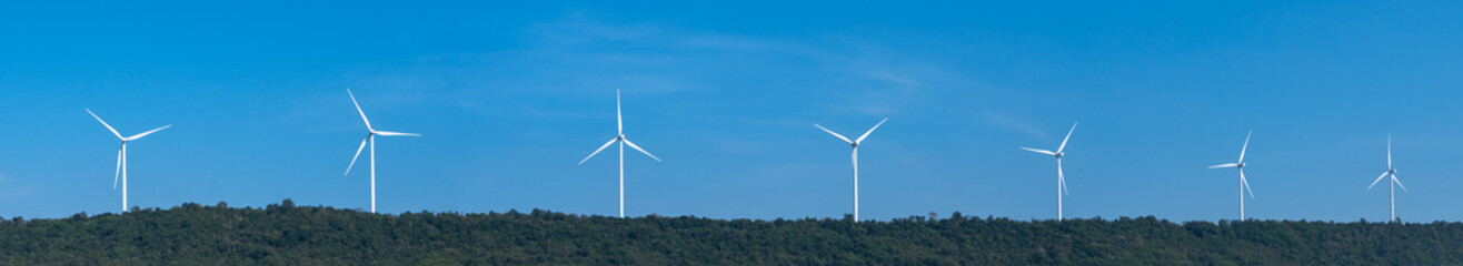 Panorama view on a sunny day of wind turbines generating electricity, Thailand. Clean energy from nature.