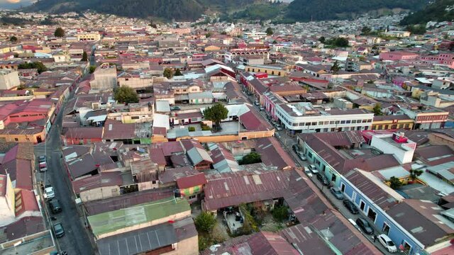 Drone Aerial View Of Urban Colonial Neighborhood Buildings And Streets In Quetzaltenango Xela Guatemala During Golden Hour Sunset.